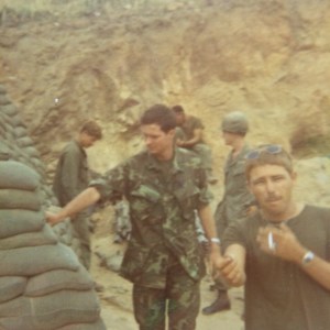 Fred Larson, Lt Gardner, Craig Collins and Dennis Lyons. Doc Snuffy sitting on bank in background